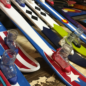 Handpainted shot skis with boot shots.