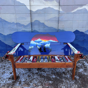 Hand Painted Frontier Bench full size chair build with bear and mountain sunset scene on blue reclaimed snowboard backrest, mixed ski seat, and ski armrests on a wood frame