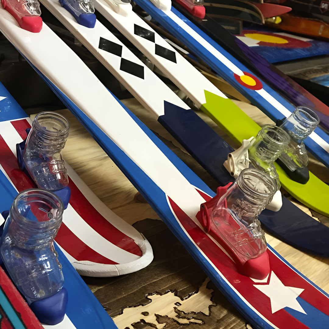 Handpainted shot skis with boot shots.