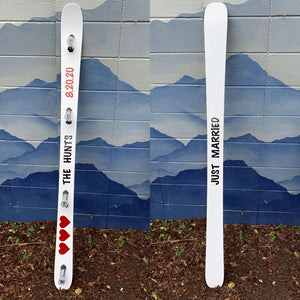 Two images of a wedding themed shot-ski with text against a mountain-themed wall.