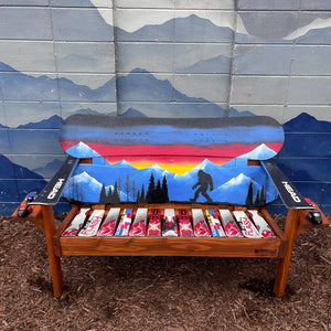 and Painted Frontier Bench full size chair build with Bigfoot and mountain sunset scene on reclaimed snowboard backrest, mixed ski seat, and ski armrests on a wood frame